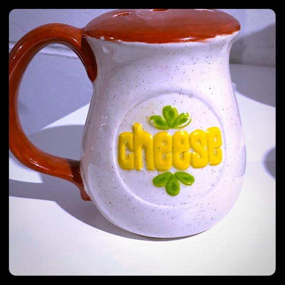 Ceramic cheese shaker with cute saying on bottom